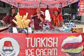 Turkish Ice Cream Vendor Performs Tricks