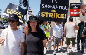 SAG-AFTRA And WGA Strike Outside Paramount Studios - LA