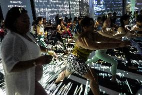 Brew Yoga At Van Gogh Alive In Bangkok.