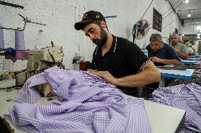 MIDEAST-GAZA CITY-FACTORY-SCHOOL UNIFORM-PRODUCTION