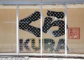 Exterior, logo and signage of Kura Sushi