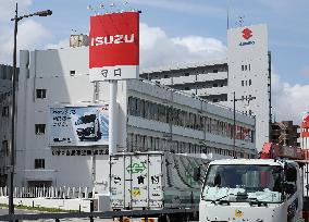 Logo and signage for Isuzu dealership.