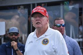 U.S. President Donald J. Trump And Walt Nauta At LIV Golf