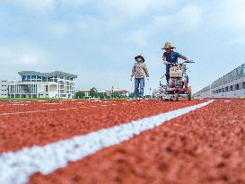 Construction Workers Carry Out Plastic Runway Marking in Lianyungang, China