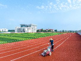 Construction Workers Carry Out Plastic Runway Marking in Lianyungang, China