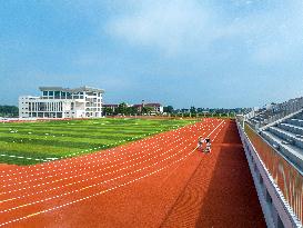 Construction Workers Carry Out Plastic Runway Marking in Lianyungang, China