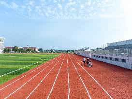 Construction Workers Carry Out Plastic Runway Marking in Lianyungang, China