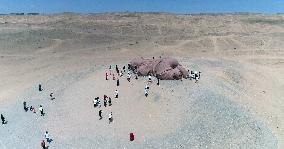 The Sculpture Son of the Earth on The Gobi Beach in Guazhou