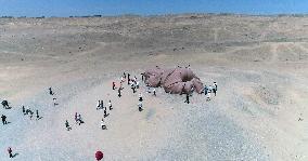 The Sculpture Son of the Earth on The Gobi Beach in Guazhou