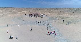 The Sculpture Son of the Earth on The Gobi Beach in Guazhou