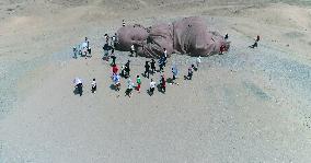 The Sculpture Son of the Earth on The Gobi Beach in Guazhou