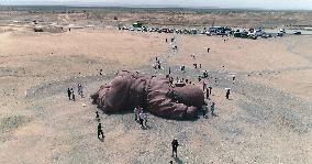 The Sculpture Son of the Earth on The Gobi Beach in Guazhou