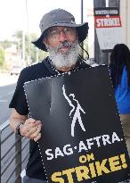 SAG-AFTRA And WGA Strike Outside Paramount Studios - LA