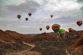 Hot Air Balloons Fly Over Colorful Danxia in Zhangye, China