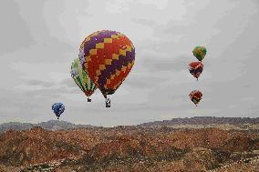 Hot Air Balloons Fly Over Colorful Danxia in Zhangye, China