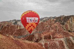 Hot Air Balloons Fly Over Colorful Danxia in Zhangye, China