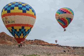 Hot Air Balloons Fly Over Colorful Danxia in Zhangye, China