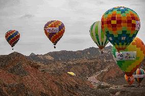 Hot Air Balloons Fly Over Colorful Danxia in Zhangye, China