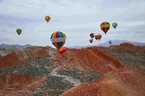 Hot Air Balloons Fly Over Colorful Danxia in Zhangye, China