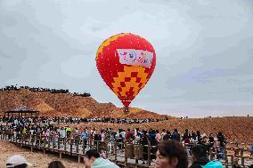 Hot Air Balloons Fly Over Colorful Danxia in Zhangye, China