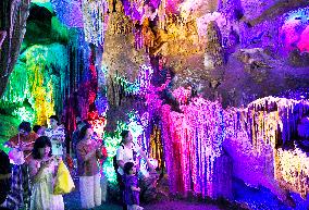 Tourists Visit The Jinshui Rock Cave in Guilin, China