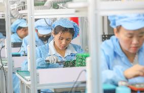 Workers Produce Integrated Circuit Chips in A Smart Workshop