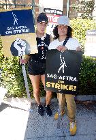 SAG-AFTRA and WGA Strike outside Warner Bros - LA