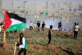 Palestinians Demonstrate Along The Israel-Gaza Border