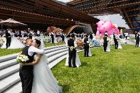 CHINA-QIXI FESTIVAL-GROUP WEDDING (CN)