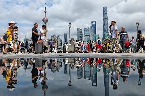 Tourists Enjoy The Bund Scenic Area in Shanghai