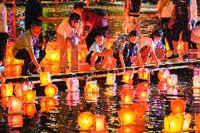 People Float Lanterns in the Zijiang River in Guilin