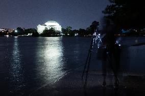 Blue supermoon rises behind Jefferson Memorial in Washington, DC