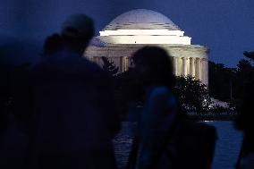Blue supermoon rises behind Jefferson Memorial in Washington, DC