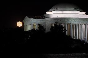 Blue supermoon rises behind Jefferson Memorial in Washington, DC, August 31