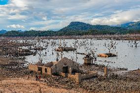 Due To The Extremely Dry Weather, The Moragahakanda Reservoir Has Dried Up, And The Old Ruins Have Been Exposed.