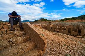 Due To The Extremely Dry Weather, The Moragahakanda Reservoir Has Dried Up, And The Old Ruins Have Been Exposed.