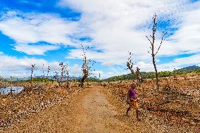 Due To The Extremely Dry Weather, The Moragahakanda Reservoir Has Dried Up, And The Old Ruins Have Been Exposed.