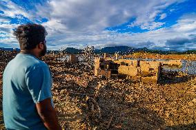 Due To The Extremely Dry Weather, The Moragahakanda Reservoir Has Dried Up, And The Old Ruins Have Been Exposed.