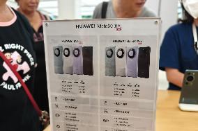 Customers Try Huawei's Mate60 Pro Mobile Phone in Shanghai