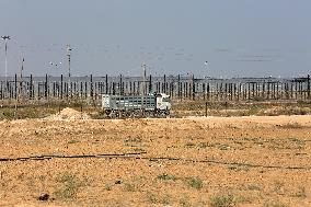 Palestinian Trucks In Front Of The Kerem Shalom Commercial Crossing, In Gaza Strip