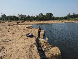 Drought-Induced Low Water Levels In Cisadane River, Tangerang