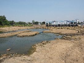 Drought-Induced Low Water Levels In Cisadane River, Tangerang