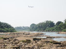 Drought-Induced Low Water Levels In Cisadane River, Tangerang