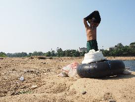 Drought-Induced Low Water Levels In Cisadane River, Tangerang