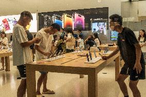 Customers Experience Apple Products at An Apple Store in Chengdu, China