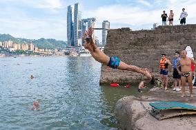 People Dive Along The Yangtze River in Chongqing