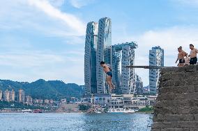People Dive Along The Yangtze River in Chongqing