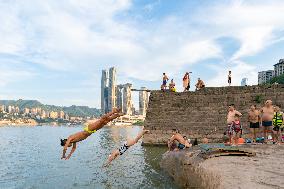 People Dive Along The Yangtze River in Chongqing