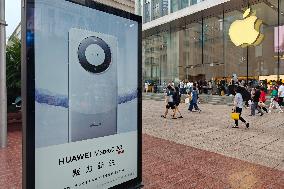 Huawei Mobile Advertising Appears in Front of The Apple Store in Shanghai