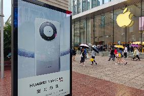 Huawei Mobile Advertising Appears in Front of The Apple Store in Shanghai